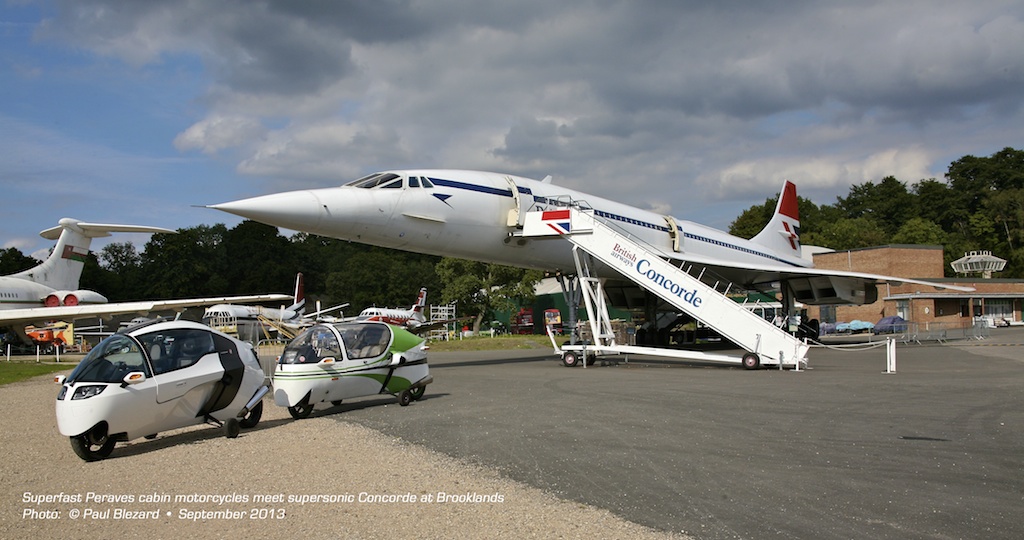 Superfast Peraves cabin motorcycles (MonoTracer and EcoMobile) meet supersonic Concorde at Brooklands, UK.